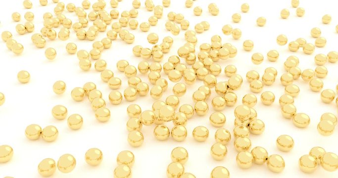 Golden rubber balls falling on a white surface 4k