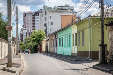 Fototapeta na wymiar Street with residential buildings in Chisinau city also known as Kishinev