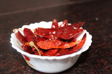 Chilli  peppers are primarily used as a spice and can be cooked or dried and powdered