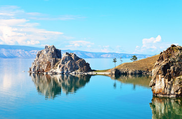 Baikal Lake on a sunny summer day. Two famous rocks of Olkhon Island - Shamanka and Hero are...