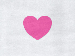 Fototapeta premium Pink heart on a grey paper background