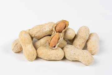 Shelled salted peanuts in shell on white background