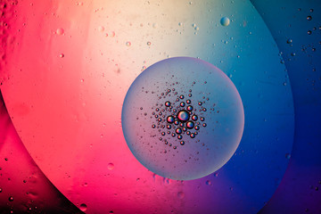 Abstract colourful creative macro oil and water background with bubbles.
