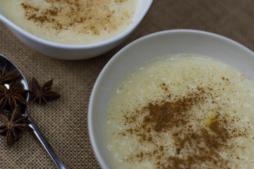 bowls of rice pudding and cinnamon