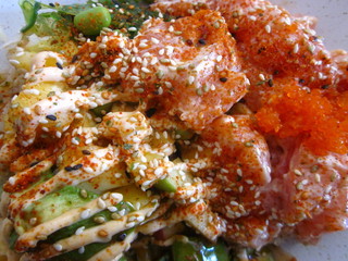 Salmon bowl with rice, avocado, whitefish roe on sushi and wok restaurant