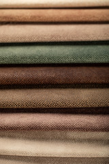 Brown and green color tailoring leather tissues in catalog