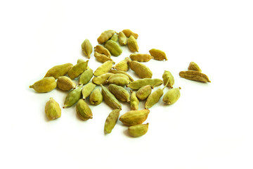 Grains of cardamom on a white background