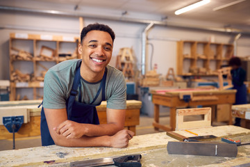 Portrait Of Male Student Studying For Carpentry Apprenticeship At College - obrazy, fototapety, plakaty