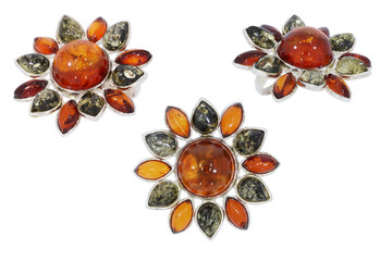 Amber jewelry set:  earrings and brooсh. Baltic amber. Vintage style fashion classic jewelry. Isolated image. 