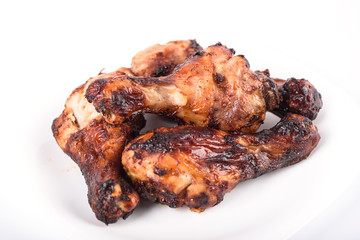 Juicy grilled chicken drumsticks marinated in soy sauce.