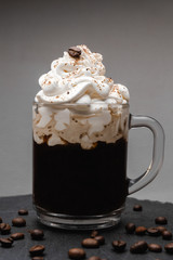 Coffee with cream on top in translucid cup