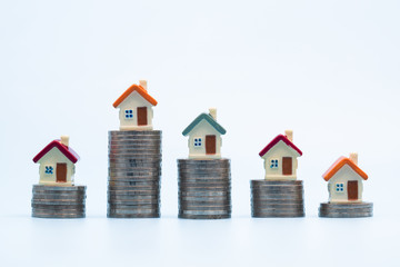 Mini house on stack of coins On  white background, Money and house,  Mortgage, Savings money for...