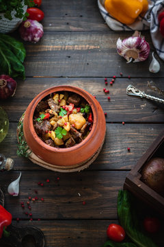 Roast in a clay pot. Braised beef with vegetables. A dish of Georgian cuisine. Chanahi