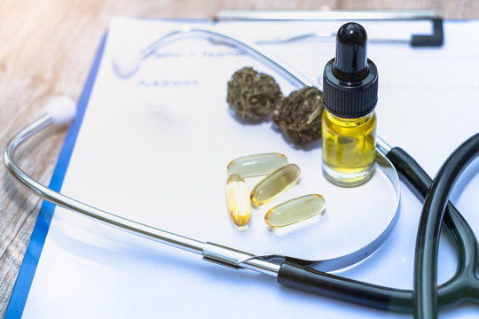 Hemp Oil Is Put On The Doctor's Prescription Stethoscope. Concepts Of Alternative Medicine, Herbal Remedies Medical Marijuana Research.