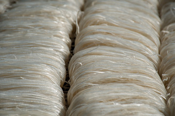 Traditional asian dry uncooked thin rice noodles
