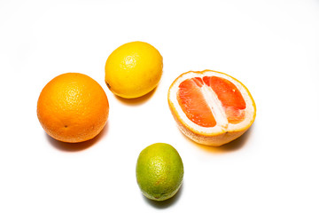 Lemon, lime, orange and grapefruit on a white background. Multiple kinds of citric together.  