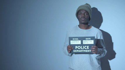 African American photographed. mugshot sign