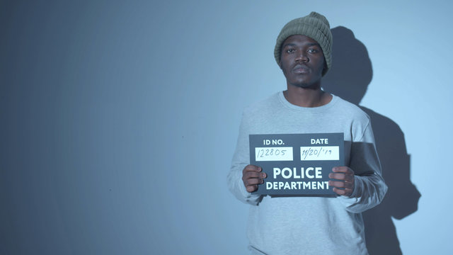 African American Photographed. Mugshot Sign