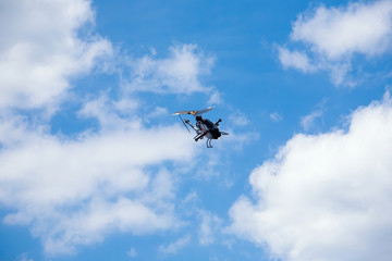 military assault helicopter performs acrobatics at an air show