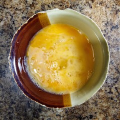 chicken yolk in bowl on kitchen table