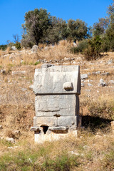 Fototapeta premium Sarcophagus ruins in the necropolis of Patara ancient city, Antalya, Turkey.