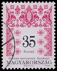 Stamp printed in Hungary shows Folk Art motives