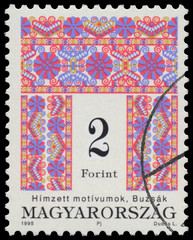 Stamp printed in Hungary shows Folk Art motives