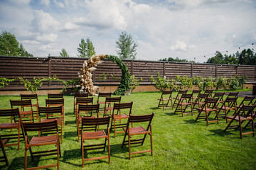 the wedding ceremony is decorated with flower arrangements and candle stands in a country restaurant 