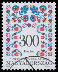 Stamp printed in Hungary shows Folk Art motives