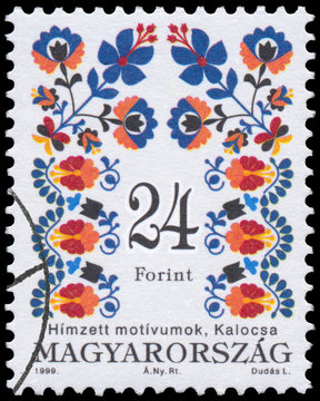 Stamp printed in Hungary shows Folk Art motives