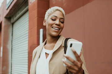 Stylish businesswoman using a smartphone