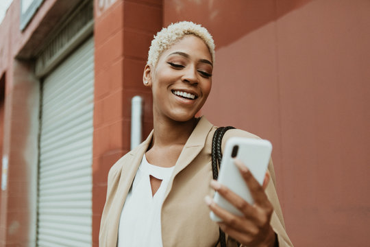 Stylish businesswoman using a smartphone