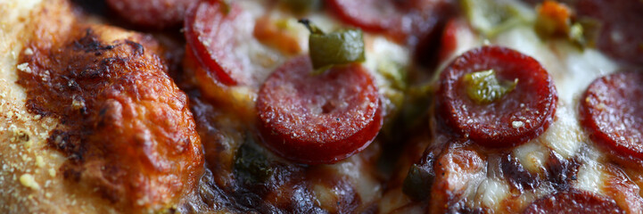 Fresh baked pizza with crusty cheese and hot tasty pepperoni