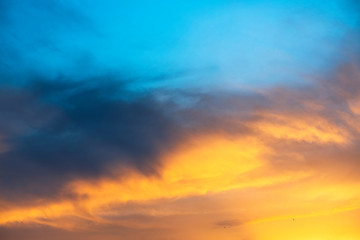 Naklejka na ściany i meble Beautiful sunset sky. Dramatic colorful clouds after sunset. Nature backgrounds. 