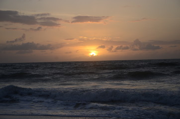 Sky, clouds, sun, beach, water 