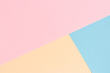 Background in pastel colors. Pink, blue, beige backdrop.