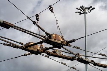 Trolleybus wires against the blue sky. close up.