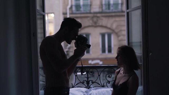 guy shoots a girl on a retro video camera