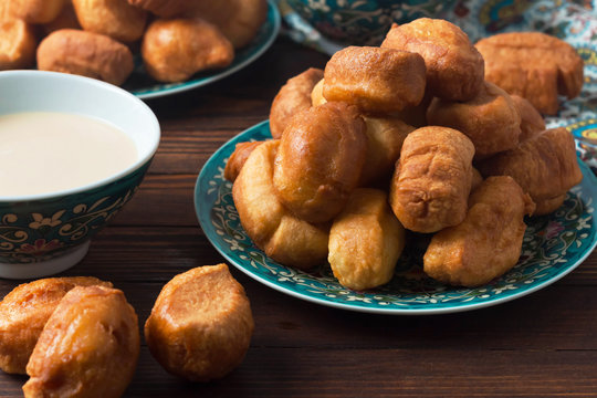 baursaki in a plate with a national pattern, Bashkir dishes, Uzbek dishes, oriental cuisine