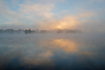Foggy landscape at dawn of Whitford Lake, Fort Custer State Park, Michigan, USA