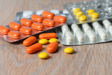 Close-up of tablet packages on the table. Concept of protection and treatment of coronavirus infection.