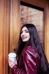 young pretty girl outside in city street with coffee happy smiling, lifestyle fashion peopple concept