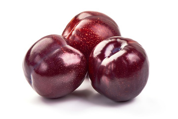 Juicy red plums, isolated on white background