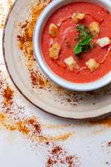 Homemade tomato soup with bread, mint and olive oil