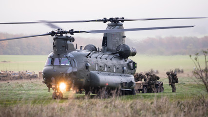 RAF Chinook helicopter on a training mission during Exercise Wessex Storm on Salisbury Plain Training Area, Wiltshire, UK - obrazy, fototapety, plakaty
