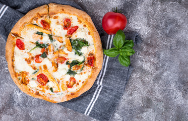 Italian pizza with tomato, mozzarella and chicken