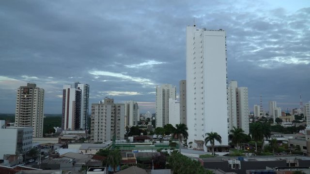 Beautiful view of city skyline buildings, houses and streets at dusk in downtown Cuiaba neighborhood, Mato Grosso, Brazil. Concept of architecture, urban, modern and development. 4K