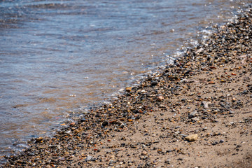 Soft Wave Of Blue Sea On Sandy Beach. Background - Summertime concept