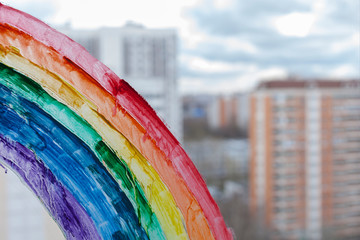 painting rainbow during Covid-19 quarantine at home. Stay at home Social media campaign for...