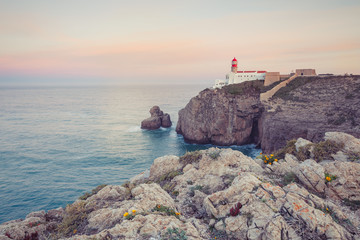 View of the lighthouse and cliffs at Cape St. Vincent at sunset. Continental Europe's most...